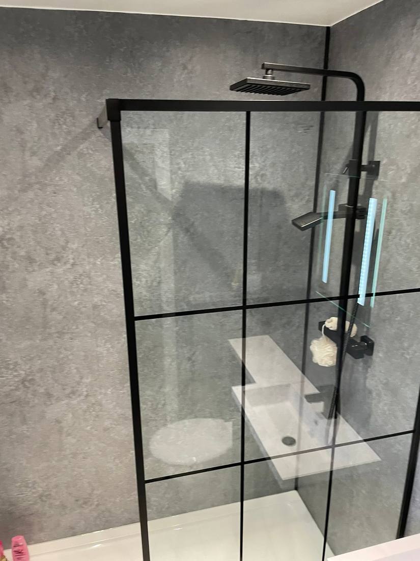 Walk-in wet room shower with black fittings
