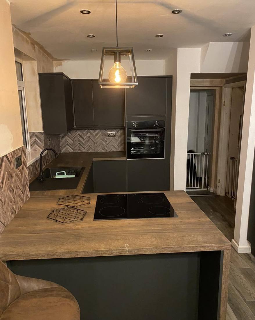 Charcoal kitchen island with herringbone splashback